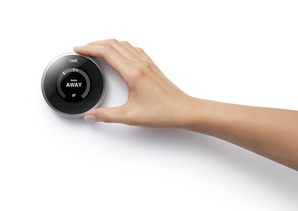 nest_thermostat_with_hand