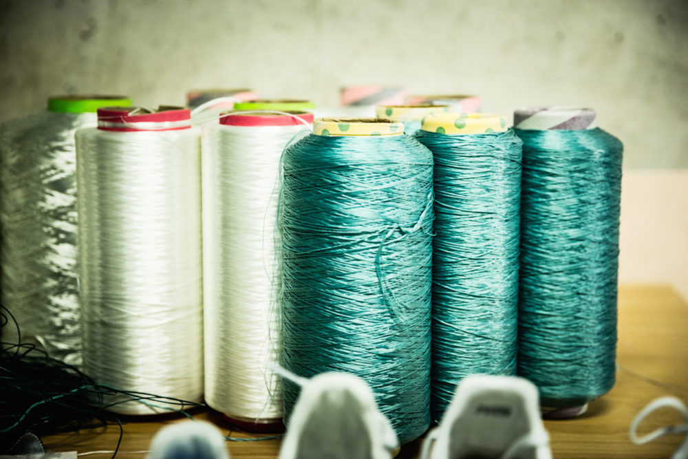 Adidas upcycling plastic materials into fibers