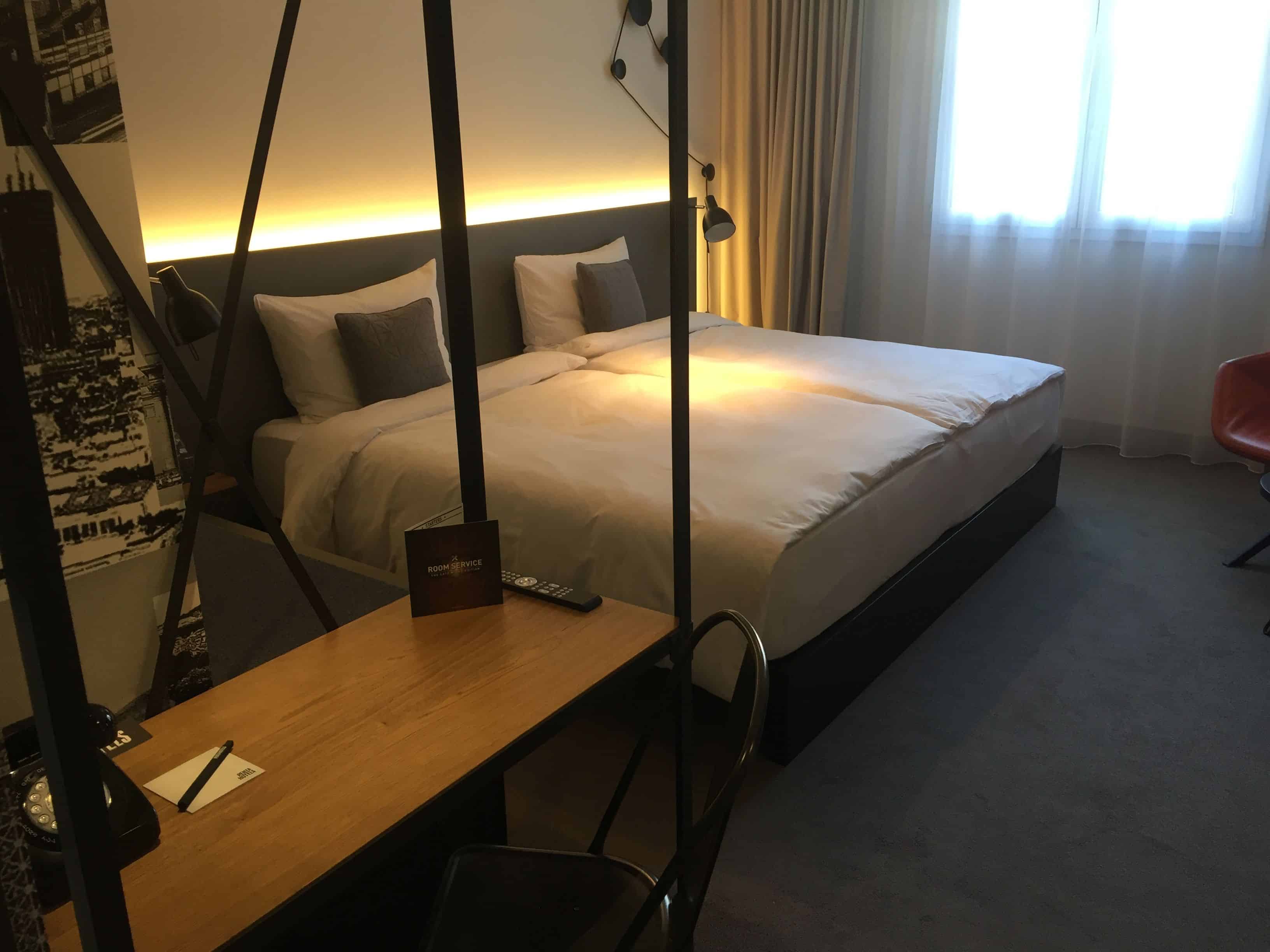 Cozy room design with industrial accents - v3 pentahotel Paris