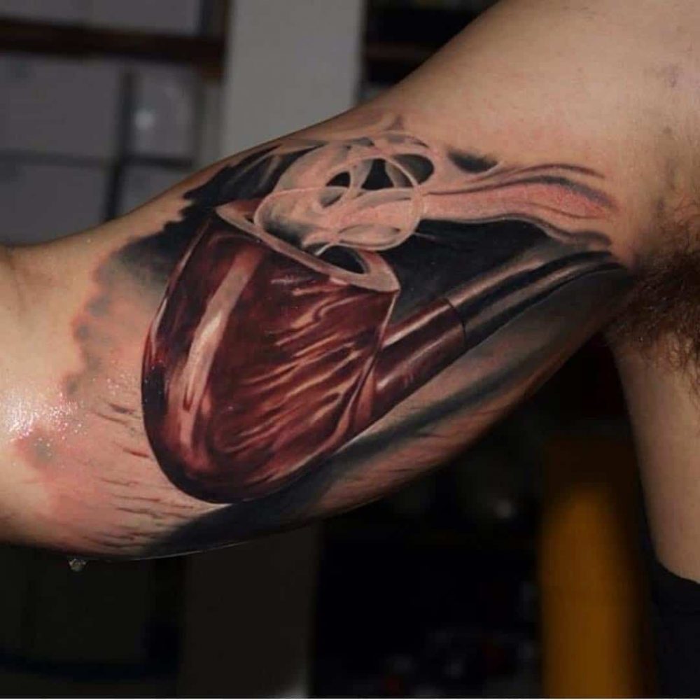 A smoking pipe tattoo incorporating scar tissue