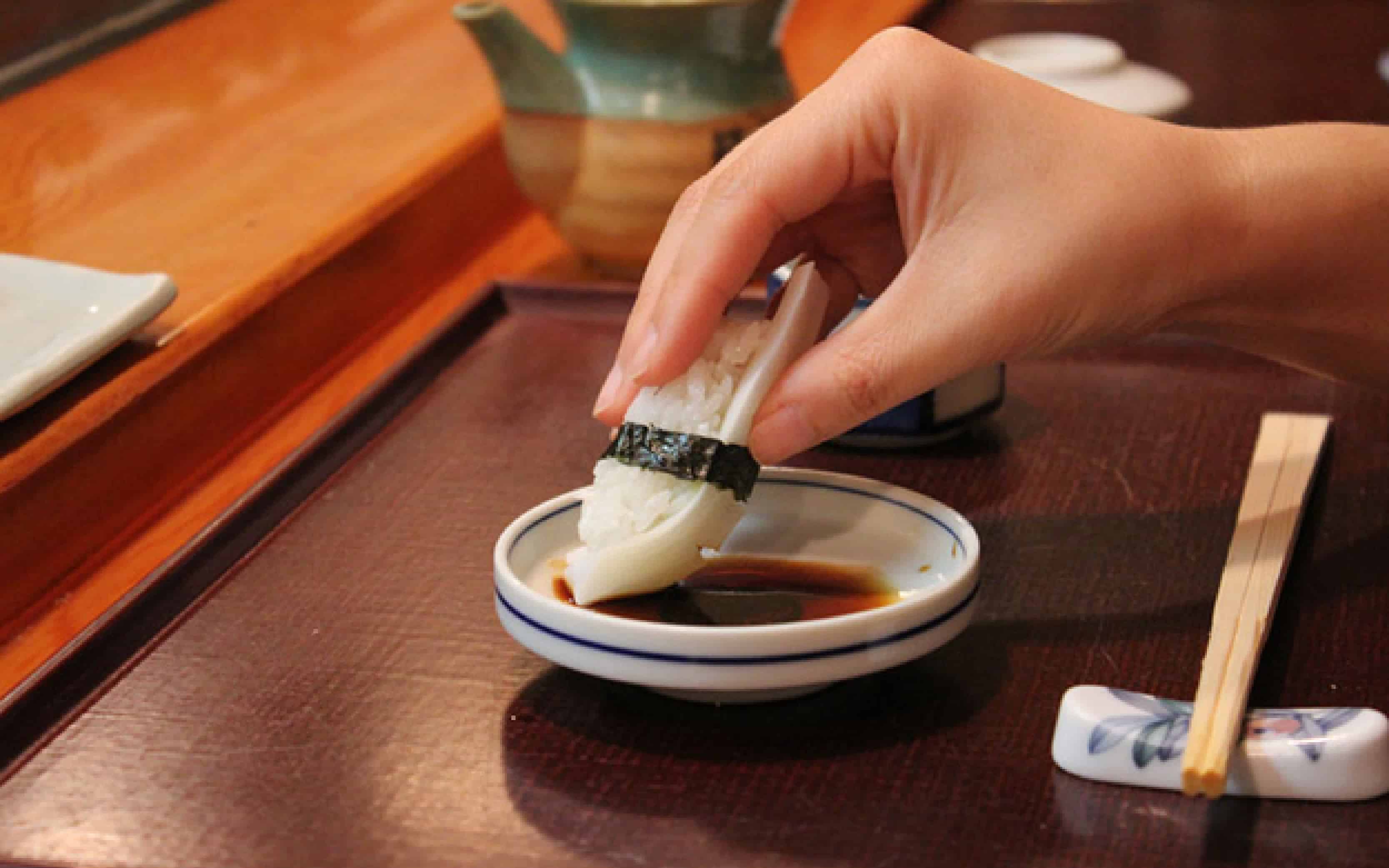 Dipping Sushi in Soy Sauce - how to eat sushi