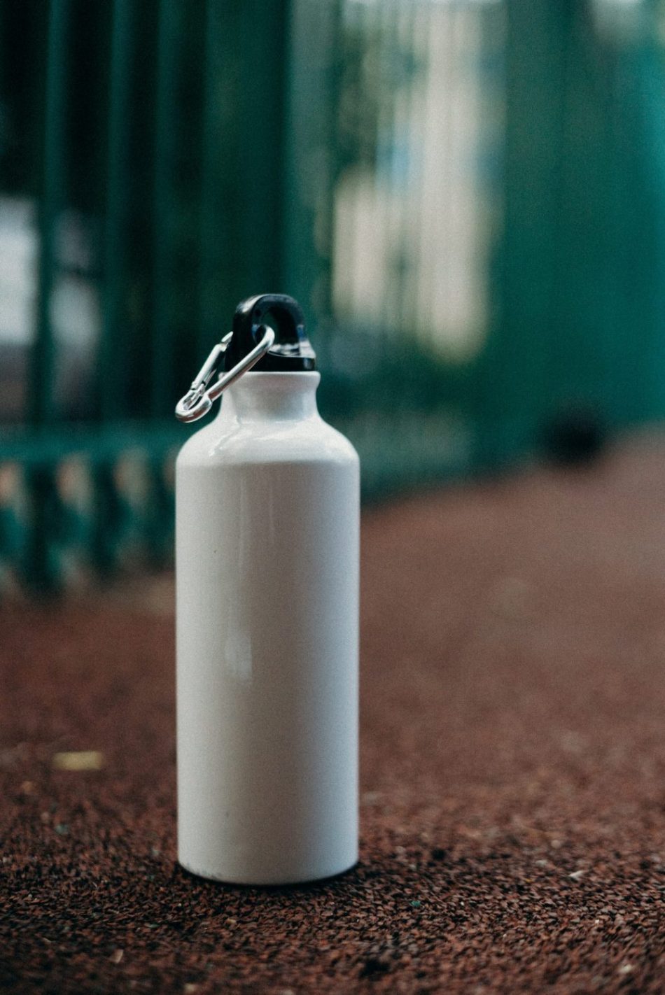 A modern filtered water bottle sitting in the dugout