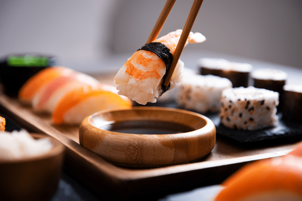 Use Your Middle Fingers to Gently Control the First Chopstick When Eating Sushi