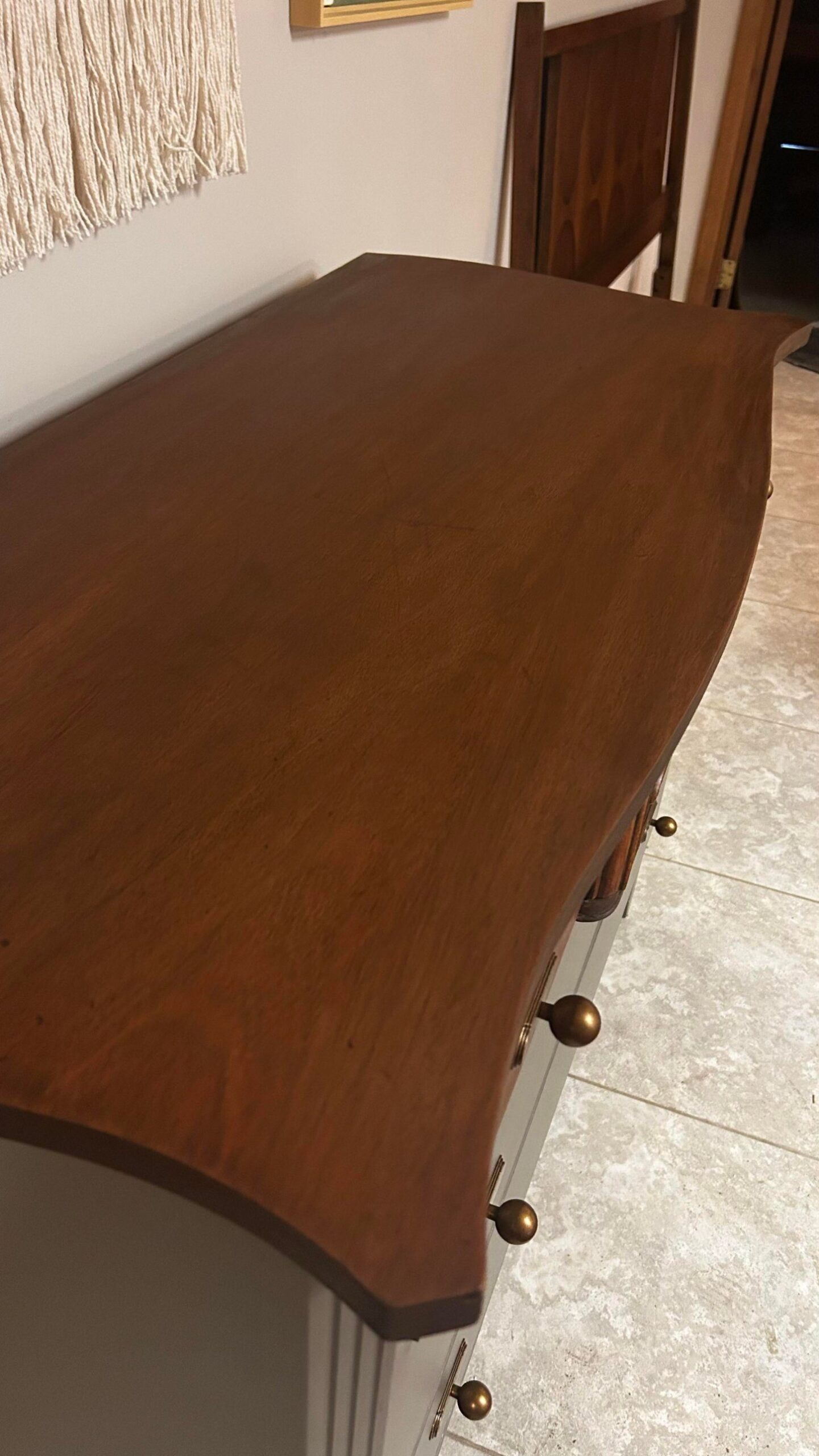 Overhead close-up of the dresser top finished in Minwax Antique Walnut, showing warm honey-brown wood grain and a smooth even finish.