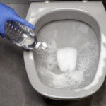 Pouring vinegar into the toilet once a week
