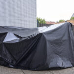 Covering your patio furniture with a tarp after rain isn't protecting it