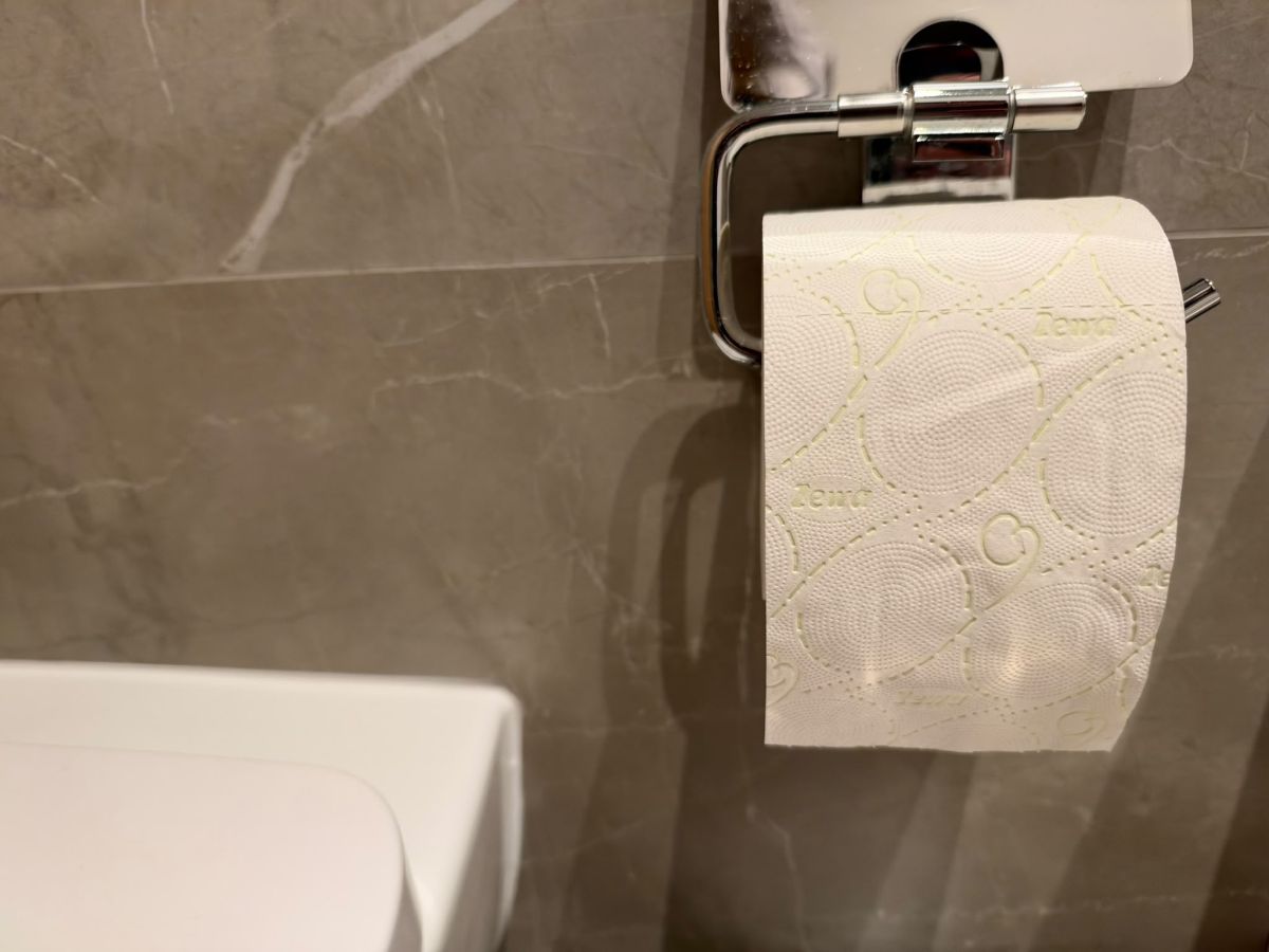 Embossed tissue on a bathroom roll holder