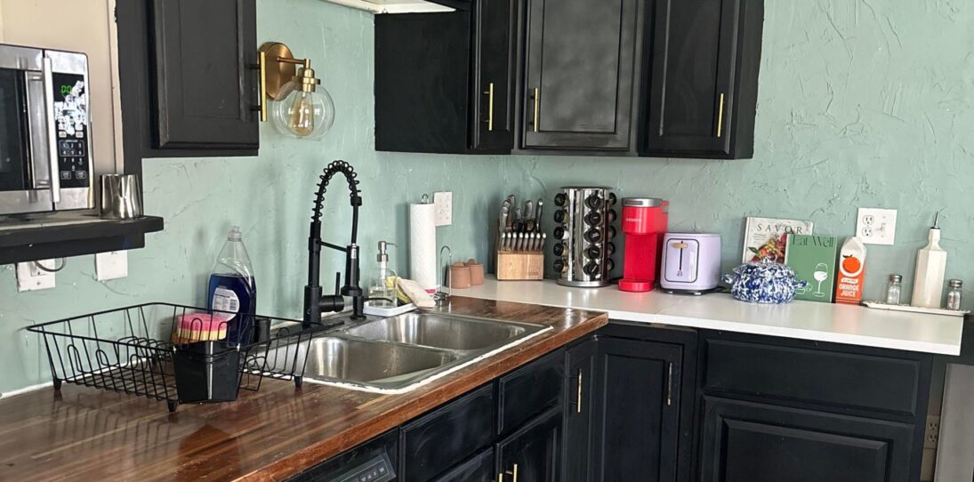 She ripped out her black-painted oak cabinets and ugly green walls: the $15K redo went far beyond paint