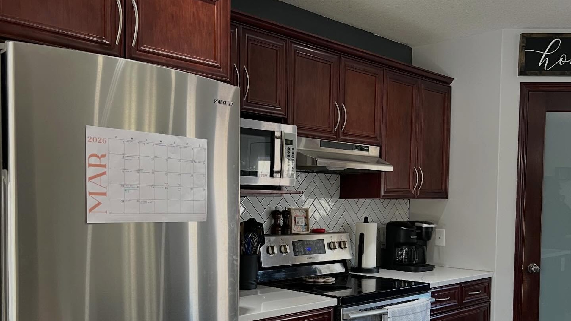 She sprayed cherry cabinets Chantilly Lace with Sherwin-Williams Gallery Series:...