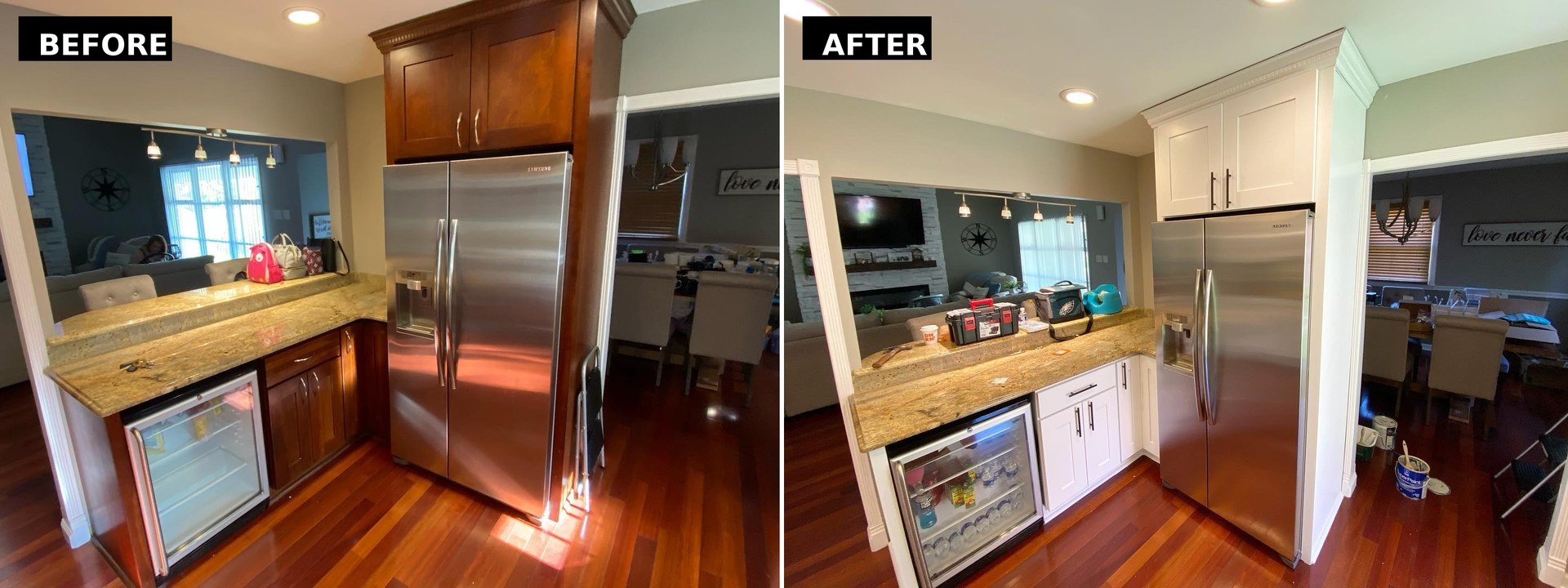 Side by side of the fridge and beverage bar area, cherry cabinets around the stainless fridge on the left and white painted cabinets with black bar pulls on the right.