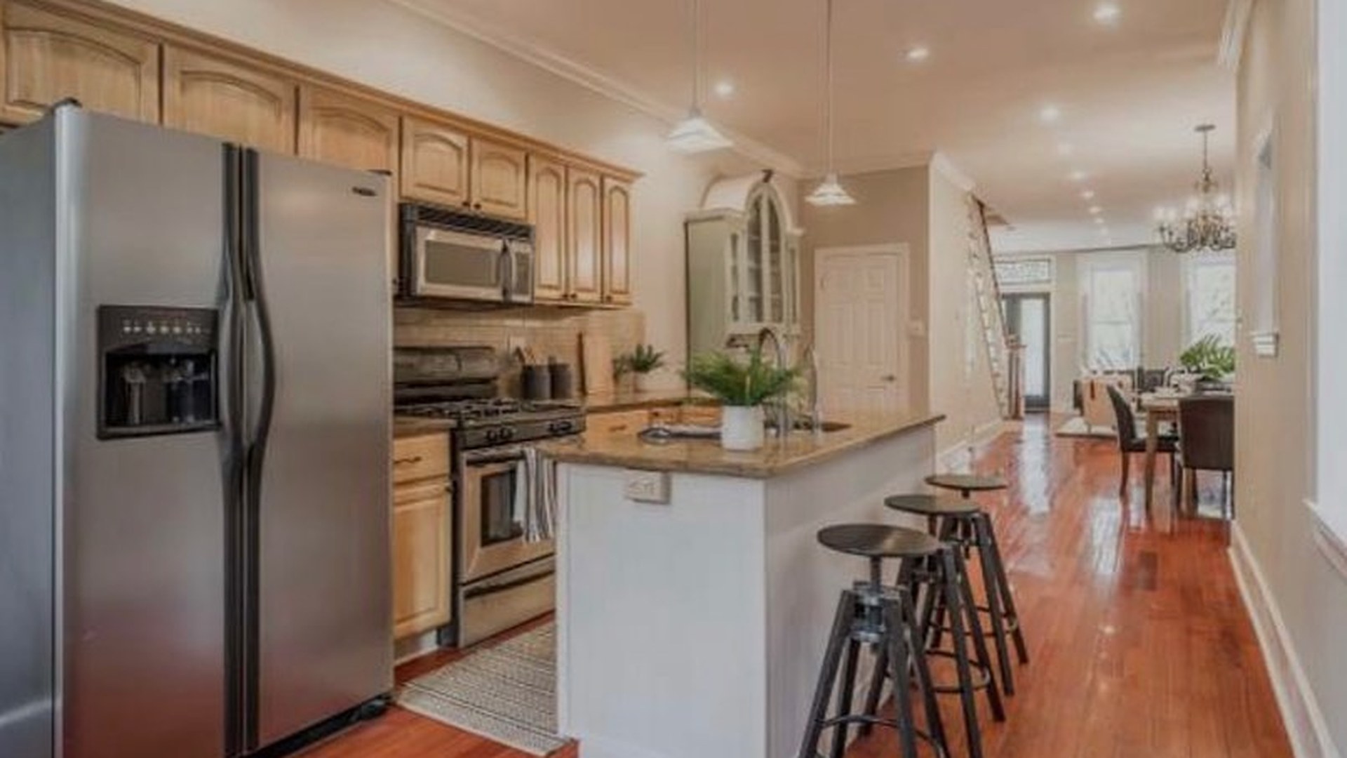 She kept every arched cabinet and sprayed them Sherwin-Williams Clary Sage: same...