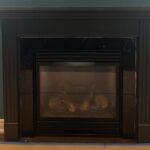 They replaced a dark espresso mantel with White Chevron and a 200-year-old beam: now it looks custom