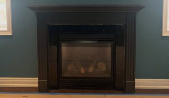 They replaced a dark espresso mantel with White Chevron and a 200-year-old beam: now it looks custom