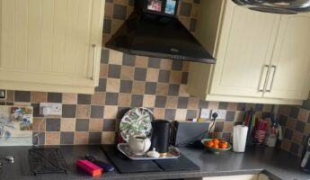 They painted cream arched cabinets Farrow & Ball Breakfast Room Green: same checkerboard tile, a new kitchen