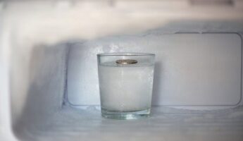 Few people know why you should leave a coin on a cup of ice in the freezer