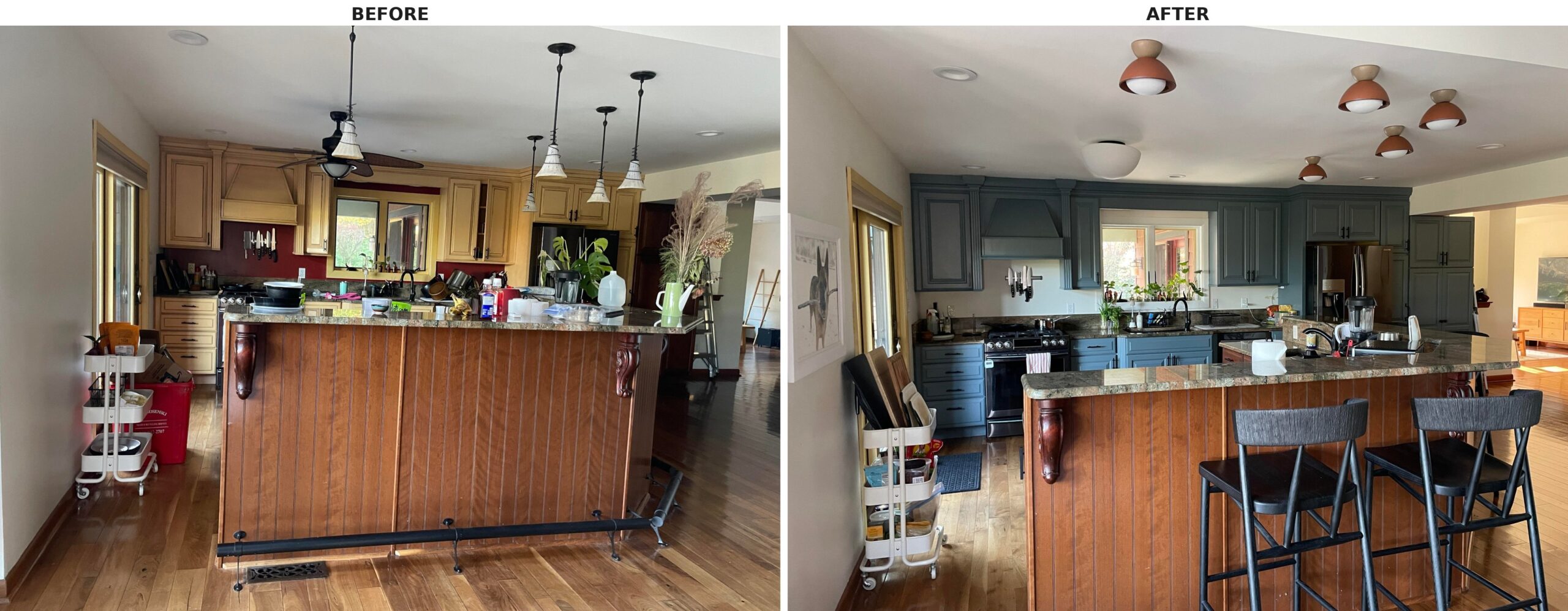 Side by side wide view of the kitchen, warm yellow cabinets with a tropical fan and globe pendants on the left, deep blue cabinets with small terracotta dome lights on the right.